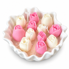 Petal Bloom Candle with pink and cream wax tulip buds in a white scalloped bowl
